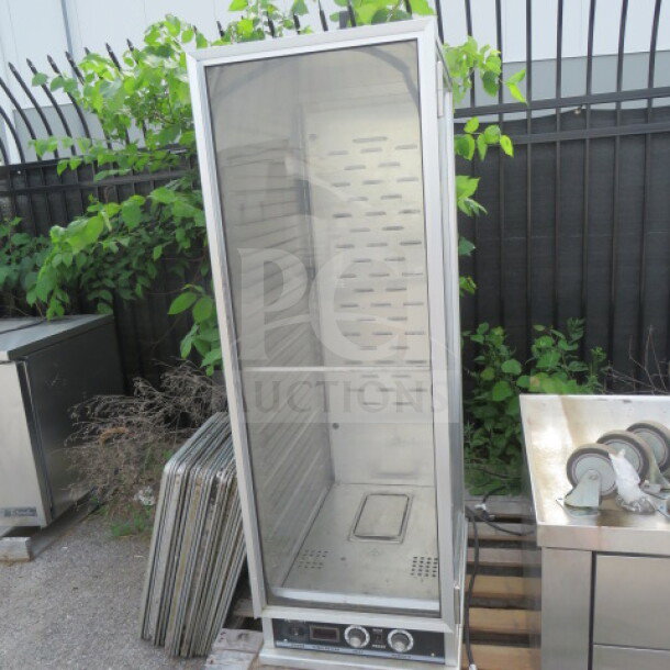 Adcraft Heat and Hold cabinet on casters, dimensions 20.5x31x67 inches, durable stainless steel construction, adjustable controls.