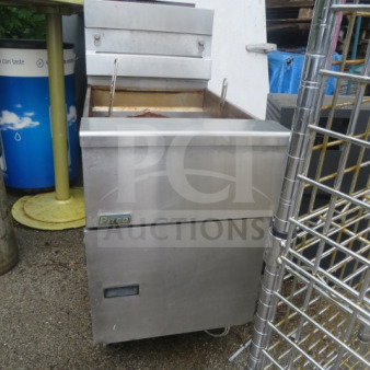 Pitco SG18 natural gas fryer on casters, 65lb capacity, stainless steel, visible wear, 19.5x34x43.5 inches.