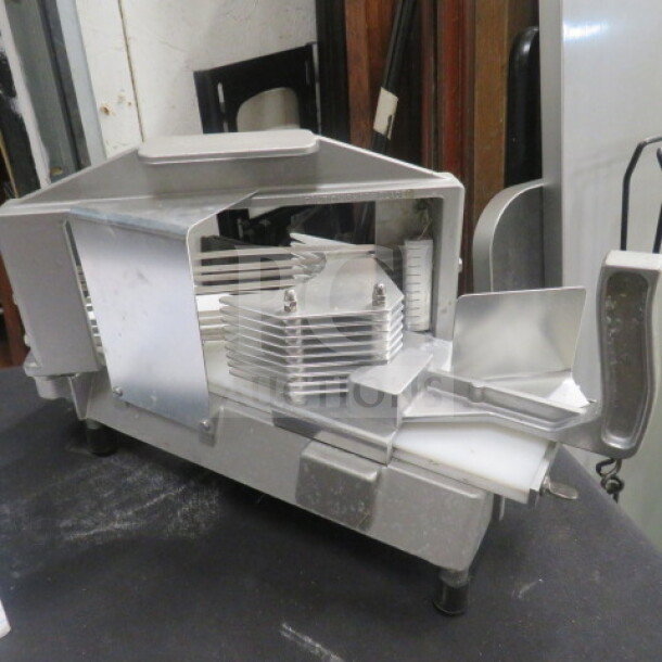 Commercial-grade stainless steel tomato slicer with sharp blades, sturdy body, and ergonomic handle. Ideal for kitchen use.