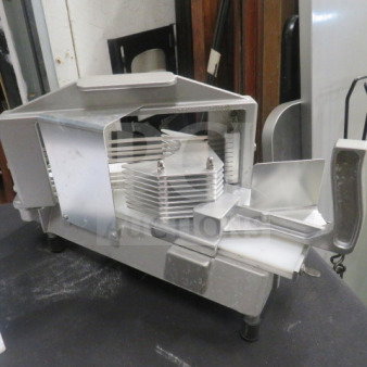 Commercial-grade stainless steel tomato slicer with sharp blades, sturdy body, and ergonomic handle. Ideal for kitchen use.