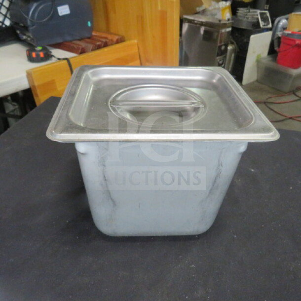 1/6 size hotel pan with lid, 6-inch deep. Stainless steel construction, lightly used condition. Suitable for catering.