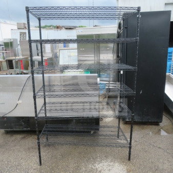 Black Metro shelf with 6 wire shelves, measuring 48x24x75 inches, in used condition.