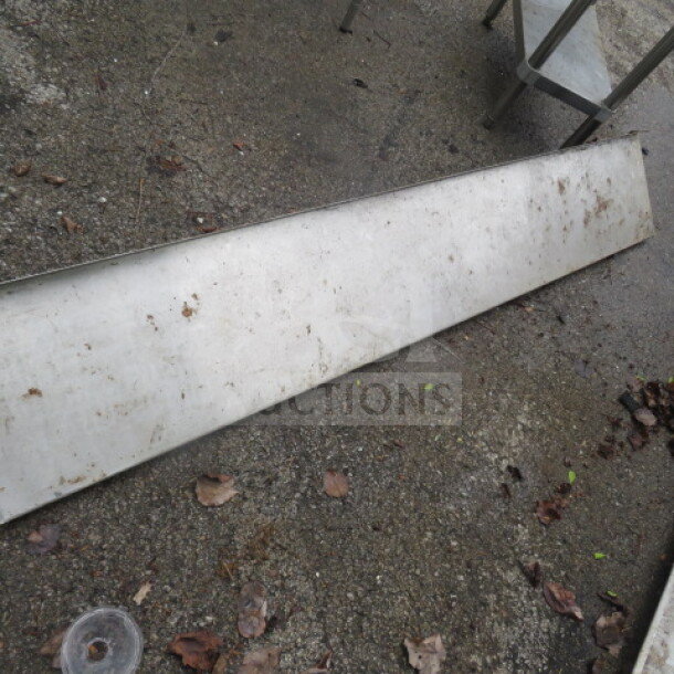 Stainless steel wall mount shelf, 72x12x12 inches, heavy-duty, outdoor condition with visible dirt and weathering.