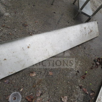 Stainless steel wall mount shelf, 72x12x12 inches, heavy-duty, outdoor condition with visible dirt and weathering.