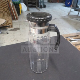 Clear water pitcher with a black locking cap and handle. Model 5XBID. Appears in good condition, with no visible markings.