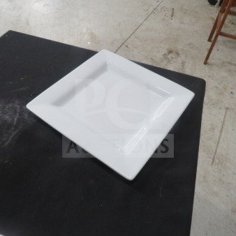 White square 11" World Plate, model 12XBID, in excellent condition on a black surface.