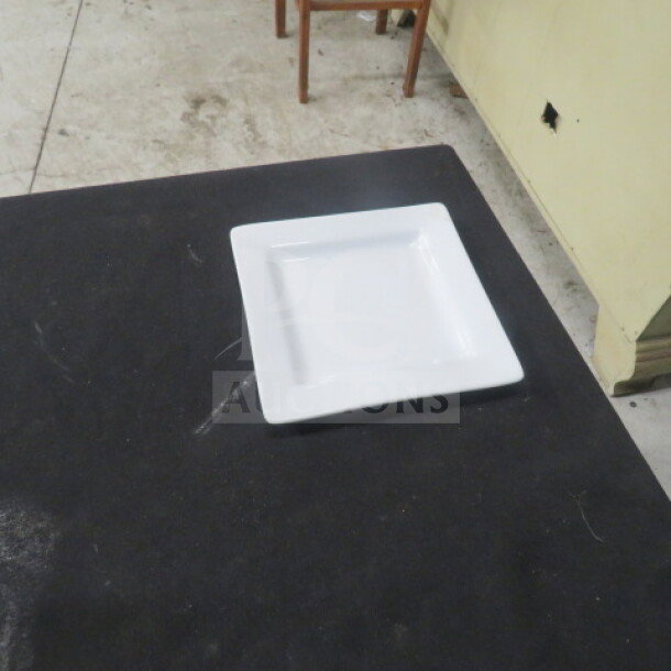 Square white plate, 6 inches, by World. Model: 12XBID. Clean, excellent condition, displayed on a dark surface.