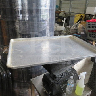 Full-size aluminum sheet pan, used condition, surface scratches, suitable for commercial kitchen use.