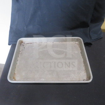 13x9.5 inch sheet pan, used condition with visible wear. Suitable for baking, brand and markings not visible.