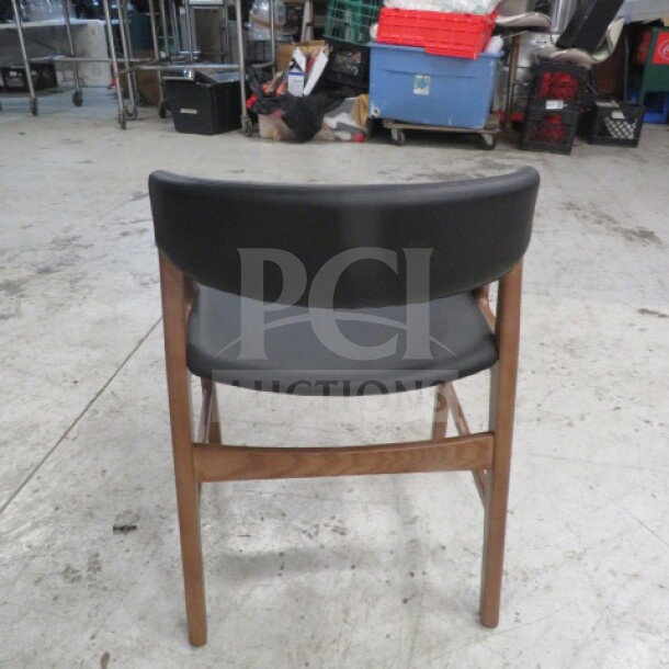 Meyer Design Form wooden barrel back chair with cushioned seat and back, features sturdy wood frame, in good condition.