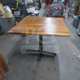 One solid wooden table top, 2-inch thick, on a pedestal base. Dimensions: 36x36x30 inches. Good condition.