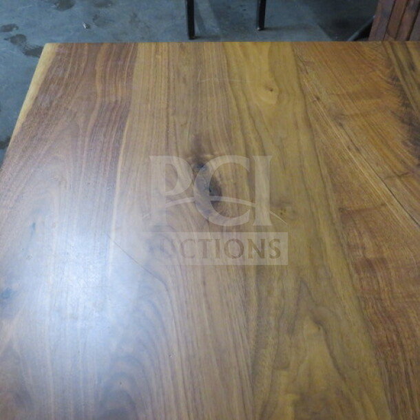 Solid wooden table top with pedestal base, 2-inch thick, 36x36x30 inches, natural wood grain, sturdy condition.