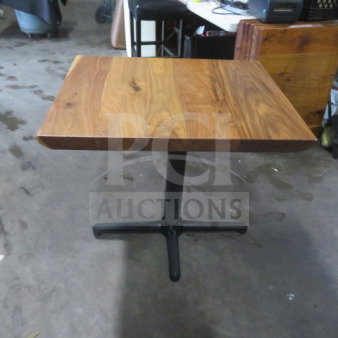 Solid wooden table with a 2-inch thick top, 24x30 inches, on a sturdy pedestal base. Appears in good condition.