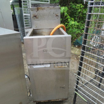 Dean natural gas deep fryer, model SR152GN, on casters. Dimensions: 15.5x29x47 inches. Worn exterior, visible logo.