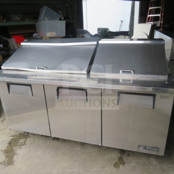 True refrigerated prep table, Model TSSU-72-30M-B-ST, with 3 doors, on casters, stainless steel, 72x34x45 inches.