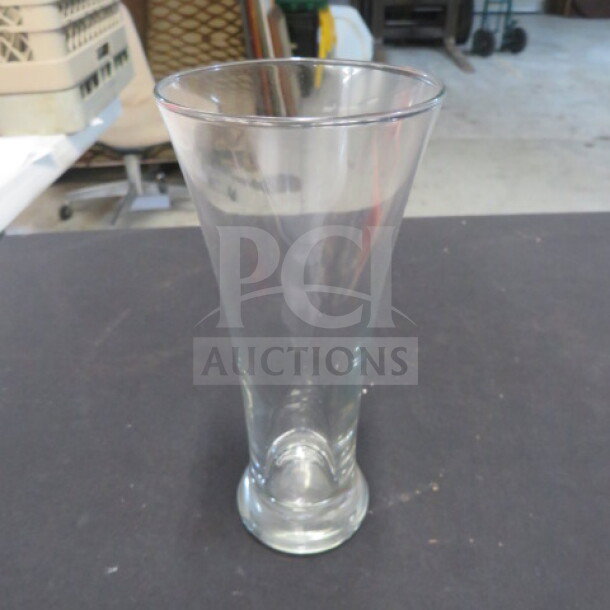Clear Pilsner beer glass, slightly flared rim, smooth finish, no visible markings, excellent condition. Ideal for collectors.
