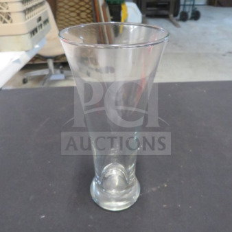 Clear Pilsner beer glass, tapered shape, 12XBID model, excellent condition, smooth finish, no visible markings.