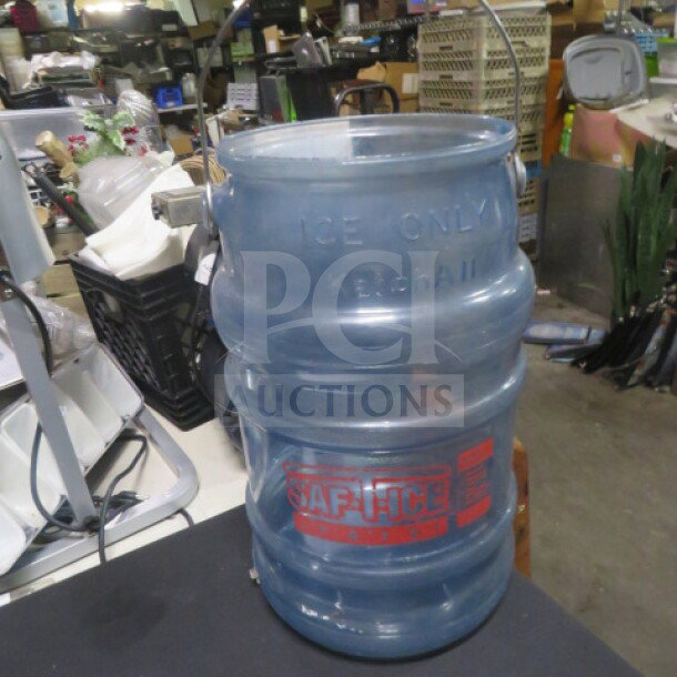 Large "Ice Only" blue plastic ice bucket with metal handle, embossed markings "KERNSCHLIE," and "SAFE-ICE" label in a storage setting.