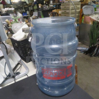 Large "Ice Only" blue plastic ice bucket with metal handle, embossed markings "KERNSCHLIE," and "SAFE-ICE" label in a storage setting.