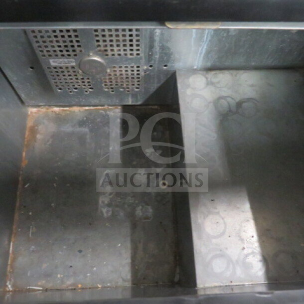 True Bottle Box Model TD-36-12 on casters, 115V, dimensions 37x27x37 inches, interior view, signs of wear.