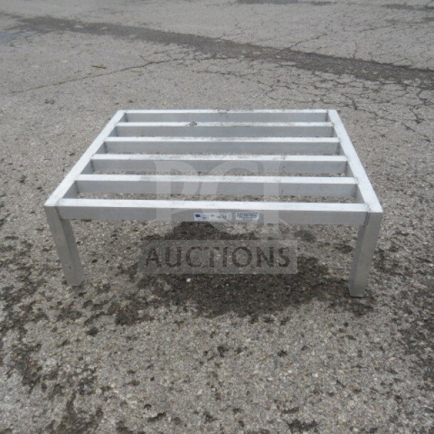 36x30x12 aluminum dunnage rack, sturdy construction, good condition, elevation for storage, visible label on side.