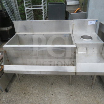 Stainless steel ice well with speed rail and blender shelf, dimensions 50x25x38 inches. Good condition.