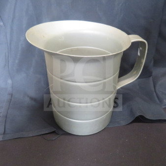 Vollrath 2-quart aluminum measurer, featuring a sturdy handle. Slight wear indicative of previous use.
