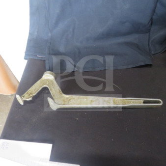 Metal bucket opener with a hooked design, used condition. Appears slightly worn, suitable for opening sealed buckets.