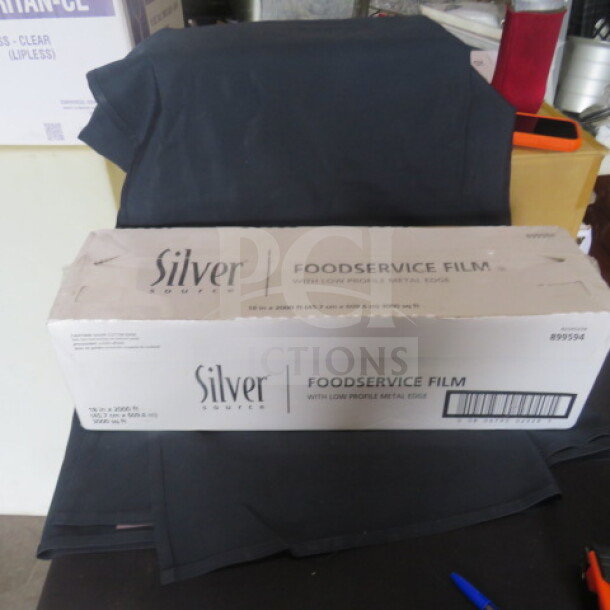 New Silver food service film, 18" x 2000ft, in original packaging, ideal for professional kitchens.
