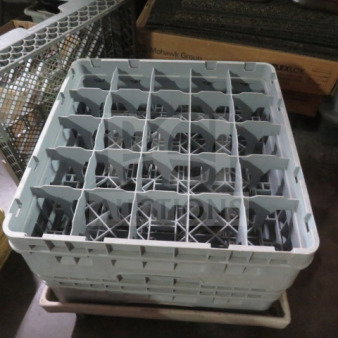 Gray 25-hole dishwasher rack, used condition, sturdy plastic construction, ideal for commercial dishwashers.