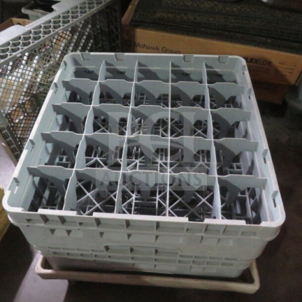 Gray 25-hole dishwasher rack in good condition, used for organizing dishes. Made of durable plastic. No visible labels.