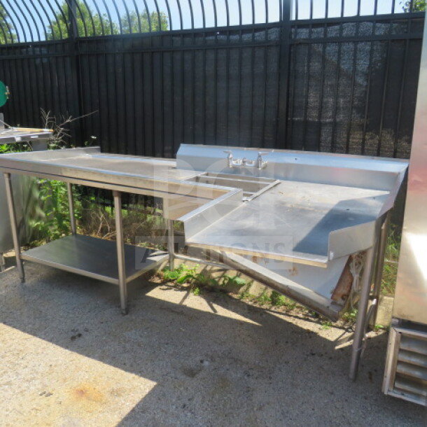 One Dirty Side dishwasher table with stainless steel undershelf, sink, and drain basket. Dimensions: 104x49x40 inches.