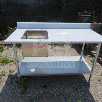 Stainless steel table with sink and backsplash, includes undershelf, measures 60x30x41 inches, new condition.