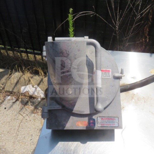 Pelican head attachment, metal exterior, used condition, visible warning labels, priced at $699.99.