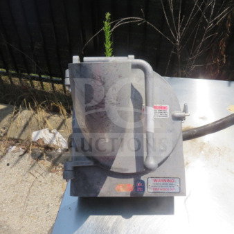 Pelican head attachment, metal exterior, used condition, visible warning labels, priced at $699.99.