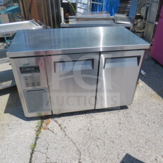 Turbo Air JUF-48D-N stainless steel 2-door worktop freezer, 48x24x32 inches, on casters, includes 1 rack, 115V, good condition.