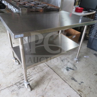 Stainless steel table with undershelf, 48x30x35.5 inches, on casters. Good condition, One Select brand.