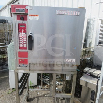 Blodgett XCEL convection oven, Model XL50EC on custom stand with casters, 208/240V, 3 phase, 31"x34"x70". Good condition.