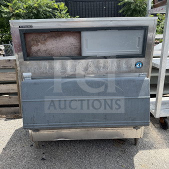 Hoshizaki ice bin, 48x39x54 inches. Stainless steel exterior, visible wear. Hoshizaki logo on top left corner.