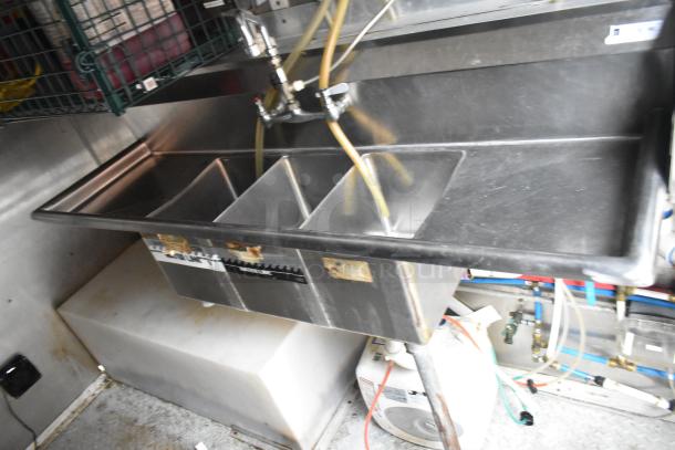 Cruising Kitchens 24' food trailer interior showing stainless steel sink with multiple compartments.