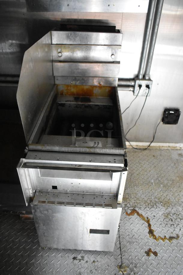Cruising Kitchens 24' food trailer interior view, showing stainless steel equipment in used condition.