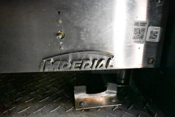 "Imperial" branded detail on a Cruising Kitchens food trailer, featuring commercial equipment, QR codes visible.