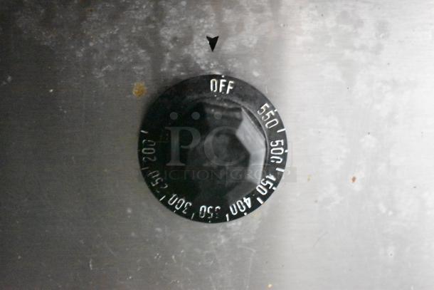 Close-up of a temperature control dial on commercial food equipment. Settings range from "Off" to 550 degrees.