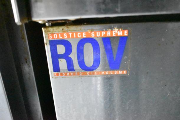 Sticker on food trailer equipment reading "Solstice Supreme ROV: Reduced Oil Volume," indicating efficiency feature.
