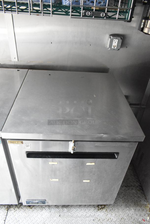 Cruising Kitchens 24' food trailer with commercial freezer, stainless steel finish, and clear title. Fully equipped interior.