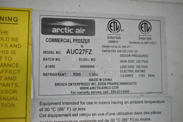 Label on Arctic Air AUC27FZ Commercial Freezer. Details model, serial number, refrigerant type, and pressure specifications.