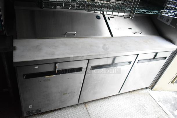 Cruising Kitchens 24' food trailer with commercial-grade stainless steel worktop and cabinets, ideal for ghost kitchen use.