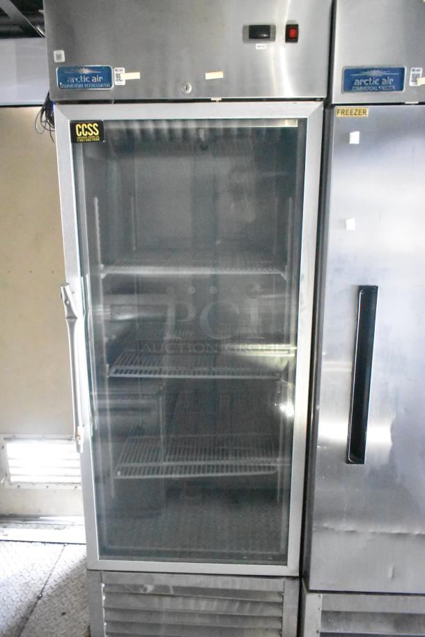 Commercial refrigerator and freezer by Arctic Air in Cruising Kitchens mobile food trailer. Stainless steel, glass door.