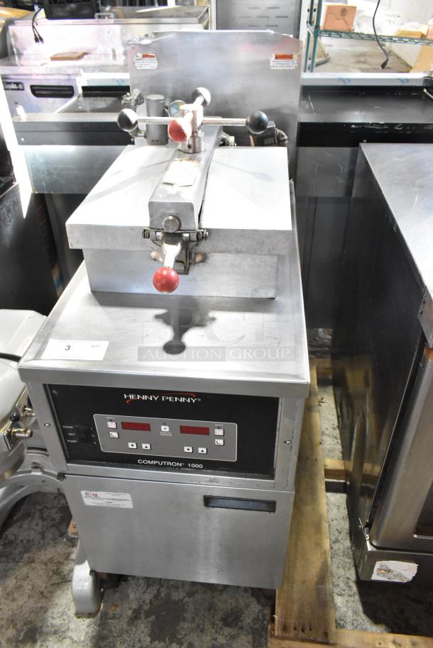 Henny Penny 600 stainless steel natural gas pressure fryer on casters. Features Computron 1000 controls, 80,000 BTU.