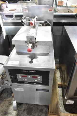 Henny Penny 600 stainless steel natural gas pressure fryer on casters. Features Computron 1000 controls, 80,000 BTU.